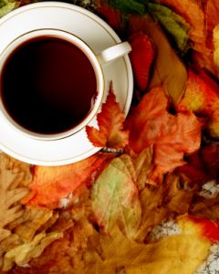 Cup and Saucer with autumn leaves, overhead view